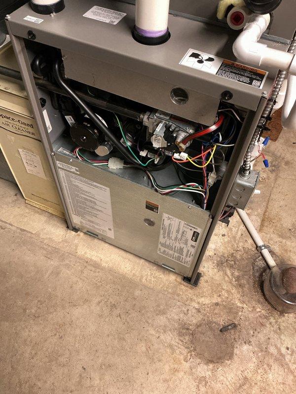 Performed comprehensive annual preventative maintenance on one-year-old residential central air conditioning system. Conducted complete system inspection including thermostat functionality verification, confirming proper temperature display and control operation at 69°F setpoint. Accessed indoor air handler unit, inspected all internal components including evaporator coil, blower assembly, electrical connections, and control boards. Verified UV light system operation and proper function of condensate drain lines and PVC piping connections. Checked all wiring connections for secure termination, inspected refrigerant lines for proper insulation and connections. System operating within normal parameters with no deficiencies noted. Unit confirmed in excellent condition with no repairs required at this time.