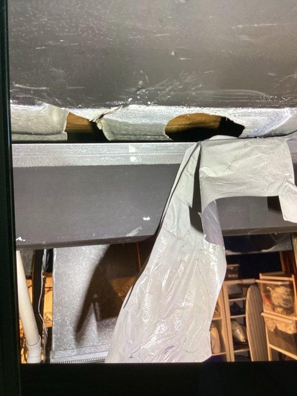 Responded to service call for reported holes in HVAC system affecting a 12-year-old furnace located in basement. Upon inspection, identified compromised return ductwork with visible openings that were allowing unconditioned air infiltration and reducing system efficiency. Documented existing conditions showing exposed ductwork, insulation gaps, and areas requiring sealing to restore proper system operation and prevent energy loss.