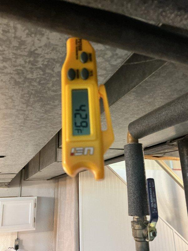 Completed annual cooling maintenance on residential HVAC system. Replaced air filter and evaporator pad as scheduled. Verified system operation with temperature readings showing 68°F return air and 52.9°F supply air, confirming proper cooling differential and satisfactory equipment performance.