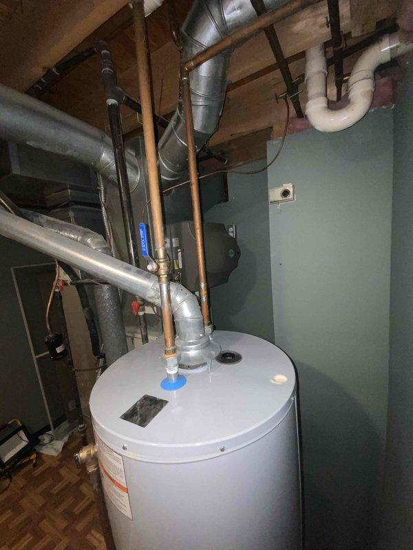 Completed on-site assessment for furnace replacement estimate on 32-year-old unit currently located in basement mechanical room. Existing furnace remains operational but has exceeded typical service life expectancy. Documented current installation configuration including ductwork connections, venting system, electrical supply, and gas line routing to provide accurate replacement specifications and ensure proper equipment sizing for the residence.