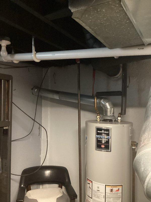 Completed full HVAC system installation including a 70,000 BTU furnace and 2.5-ton air conditioning unit with rear discharge configuration. Obtained mechanical and electrical permits prior to installation, performed all necessary electrical and gas connections, installed new ductwork register visible in basement area, and reconnected all system components to existing infrastructure. System tested and verified operational upon completion.