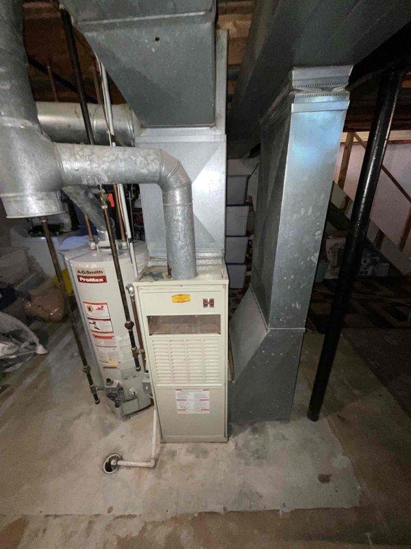 Completed full system estimate for replacement of 16-year-old furnace and air conditioning unit. Inspected existing HVAC equipment in basement utility area, documented current furnace operating condition and confirmed air conditioning unit failure. Photographed existing installation including ductwork configuration, provided comprehensive replacement options for complete heating and cooling system upgrade.