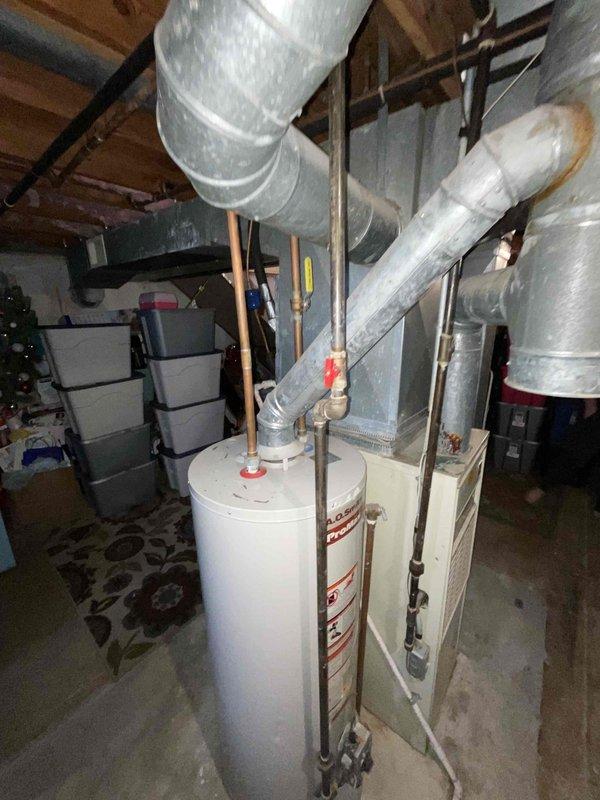 Completed full system estimate for replacement of 16-year-old furnace and air conditioning unit. Inspected existing HVAC equipment in basement utility area, documented current furnace operating condition and confirmed air conditioning unit failure. Photographed existing installation including ductwork configuration, provided comprehensive replacement options for complete heating and cooling system upgrade.
