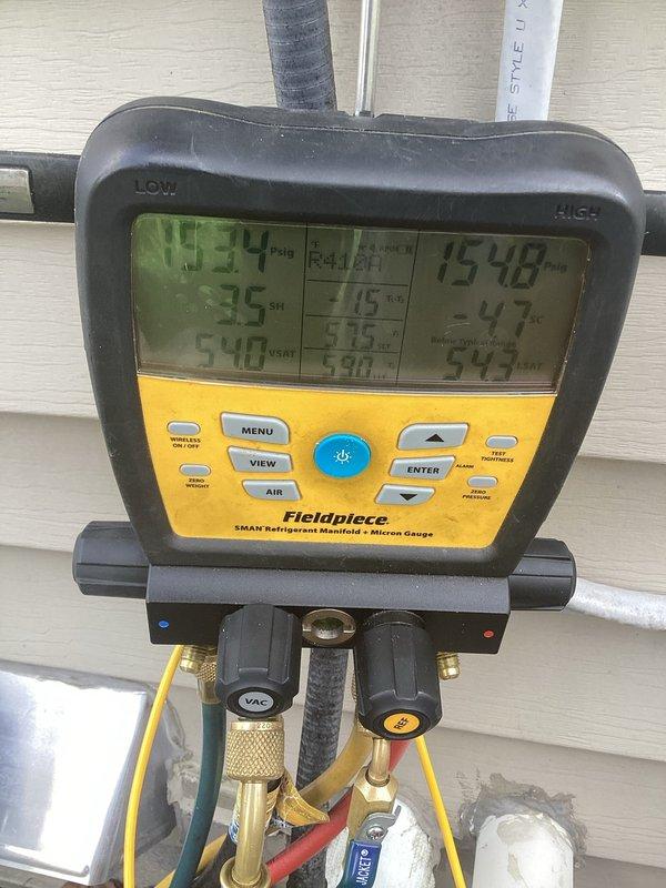 # HVAC Service Report

Responded to no-cooling complaint on 5-year-old air conditioning system. Upon arrival, performed system diagnostics using digital manifold gauges to assess refrigerant pressures and temperatures. High-side pressure reading showed 234 psig with elevated temperature of 335°F, indicating potential system issues.

Inspected electrical disconnect box at outdoor unit, verifying proper fuse installation and electrical connections. Confirmed 25-amp fusing was intact and all wire terminations at bus bars and terminal blocks were secure. Checked power supply connections including line voltage wiring.

Connected refrigerant manifold with service hoses to system ports for comprehensive pressure and temperature analysis. Monitored superheat and subcooling values to determine refrigerant charge status and system performance. Documented readings on digital gauge display for accurate diagnostics.

Performed visual inspection of outdoor unit components and electrical supply syste