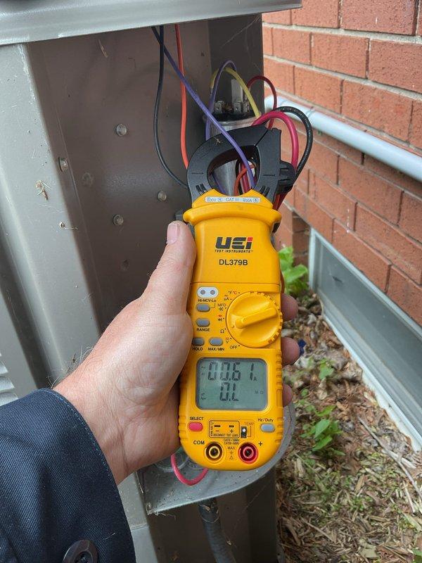 Completed annual cooling maintenance on residential air conditioning system. Performed comprehensive electrical diagnostics using digital multimeter to verify proper voltage and amperage at both the indoor air handler and outdoor condensing unit disconnect. Tested all electrical connections, measured system performance parameters, and confirmed equipment operating within manufacturer specifications. System found to be functioning properly with no deficiencies noted. Unit operational and ready for cooling season.