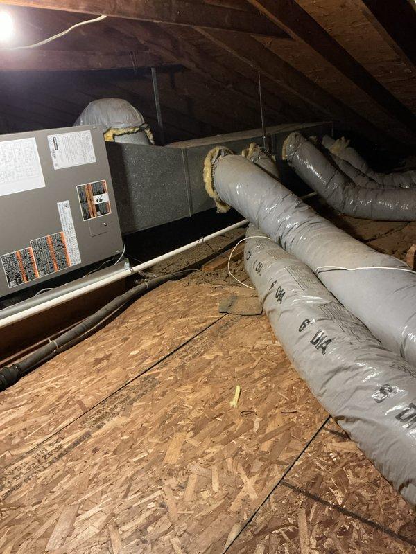 Completed full HVAC system installation in attic space, including installation of new Lennox 3.5-ton air handler unit positioned on attic platform. Installed new dedicated electrical circuit to power the air handler per code requirements. Routed and secured insulated flexible ductwork from air handler throughout attic space with proper sealing at all connection points. Configured condensate drainage system with PVC piping for proper moisture removal. All mechanical and electrical permits were obtained prior to installation. System was installed per manufacturer specifications and tested for proper operation upon completion.