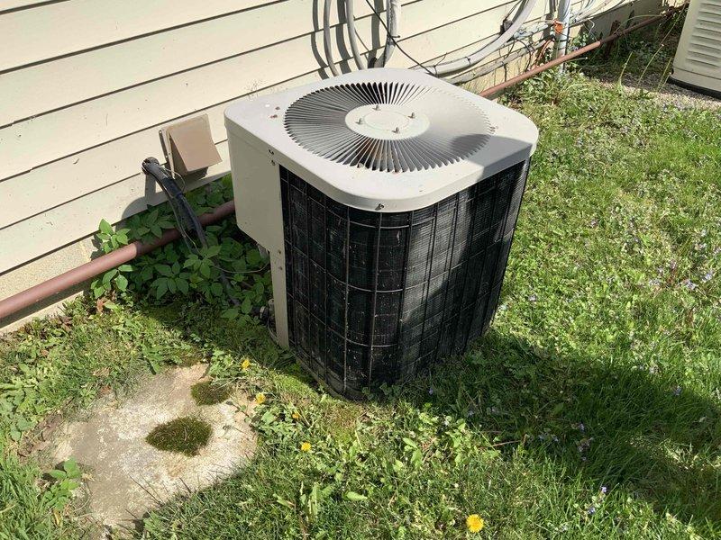 Provided estimate for replacement of 34-year-old residential air conditioning system that failed last year. Evaluated existing outdoor condenser unit on concrete pad and indoor air handler located in utility room off garage with natural gas furnace. Assessed current equipment configuration, ductwork connections, and installation requirements for new AC-only system replacement to restore cooling capacity to the home.