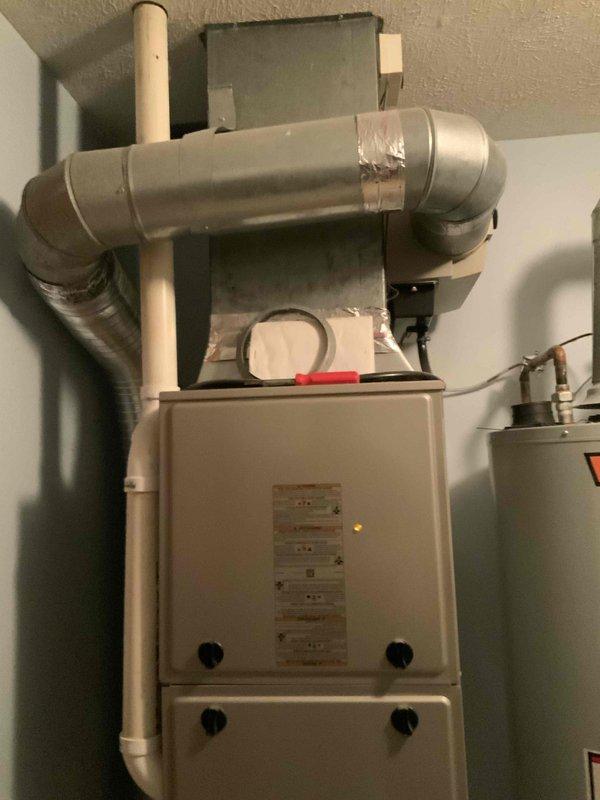 Provided estimate for replacement of 34-year-old residential air conditioning system that failed last year. Evaluated existing outdoor condenser unit on concrete pad and indoor air handler located in utility room off garage with natural gas furnace. Assessed current equipment configuration, ductwork connections, and installation requirements for new AC-only system replacement to restore cooling capacity to the home.