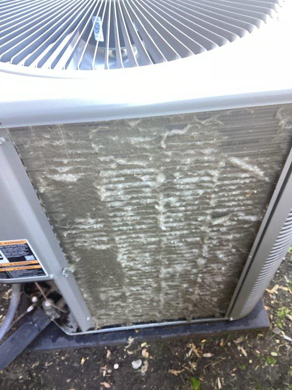 Completed annual AC tune-up maintenance on a 16-year-old Lennox system. Performed comprehensive inspection and cleaning of outdoor condenser unit, which showed significant accumulation of dirt, debris, and mineral deposits on coil surfaces. Thoroughly cleaned condenser coils to restore proper airflow and heat transfer efficiency. Inspected fan guard, refrigerant lines, and electrical components. System tested and confirmed operational with no issues found.