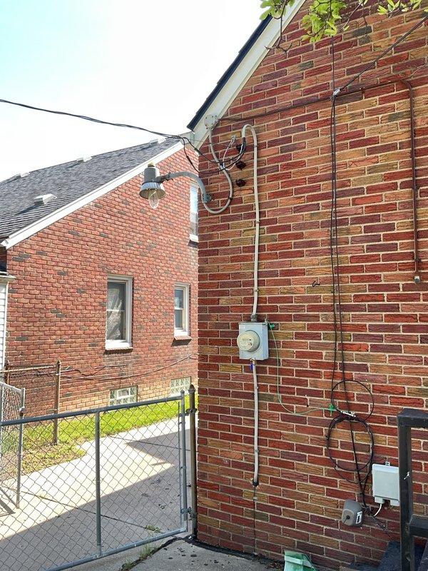 Completed comprehensive whole home electrical inspection of residential property. Performed thorough evaluation of exterior electrical service entrance, utility metering equipment, and exterior conduit installations mounted on brick exterior walls. Inspected all visible electrical wiring, connections, and service lines for code compliance and safety hazards.

Conducted interior electrical system assessment including garage electrical components and garage door opener system with LiftMaster 1/2HP unit. Verified proper installation of safety sensors, emergency release mechanisms, and electrical connections to ceiling-mounted equipment. Evaluated electrical panel accessibility, branch circuit distribution, and grounding systems throughout the residence. Documented all findings with photographic evidence for customer records. All systems inspected and findings reported to homeowner for any necessary follow-up recommendations.