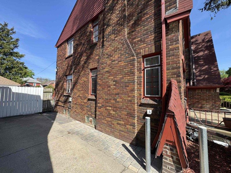 Conducted site evaluation for ductless mini-split system installation at two-story brick residential property. Assessed exterior mounting locations, photographed building structure including potential condensing unit placement areas, and inspected existing electrical panel to verify capacity and available circuits for new system installation. Customer requested estimate for installation to be completed within the next two months.