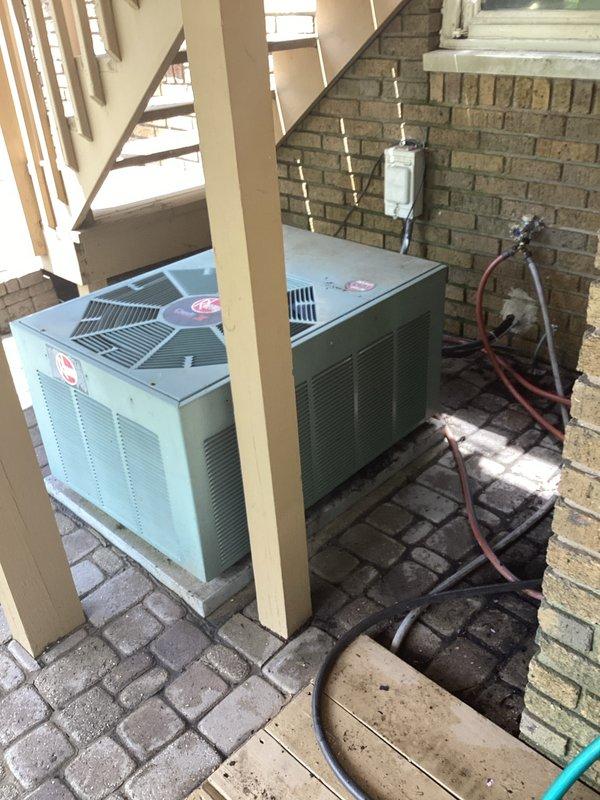 Completed annual cooling maintenance on two residential air conditioning systems located in exterior alcove. Performed comprehensive ACM service including visual inspection of both condenser units, verified proper operation of compressors and fan motors, checked electrical connections and disconnect boxes, and documented equipment condition with photographs. Both units operational with no deficiencies noted at time of service.
