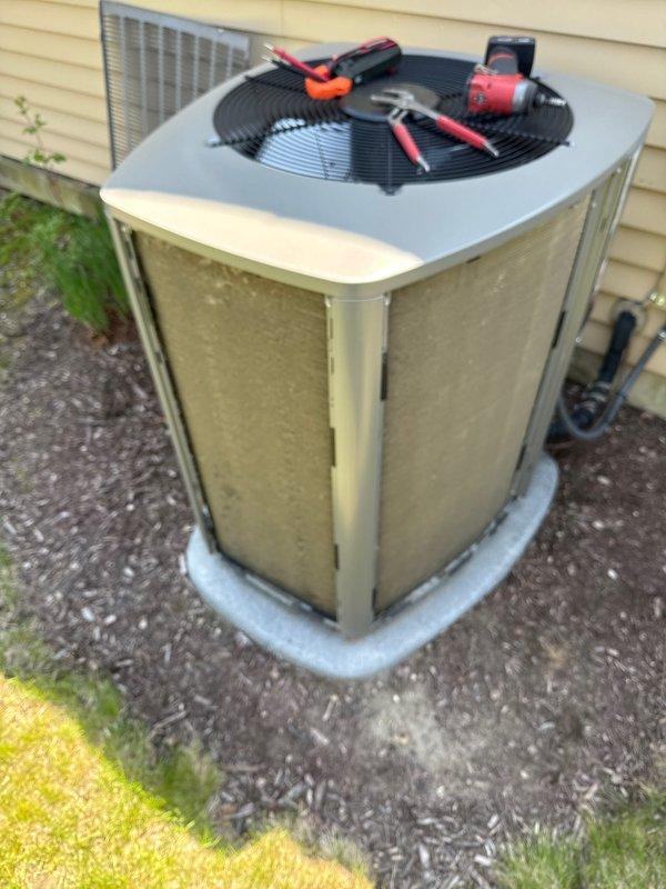 Completed annual cooling maintenance on residential outdoor condensing unit. Performed comprehensive system inspection, tested electrical components with multimeter, verified proper operation of condenser fan motor, and checked refrigerant pressures. Unit found operating within normal parameters with no immediate service needs identified.