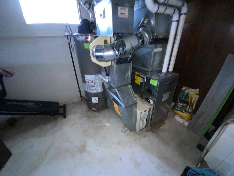 Provided comprehensive estimate for replacement of non-functional 30+ year old air conditioning system located in basement alongside recently installed furnace. Assessed existing HVAC infrastructure including ductwork, PVC condensate drainage lines, and electrical connections to determine optimal replacement specifications for natural gas furnace compatibility and proper system integration.