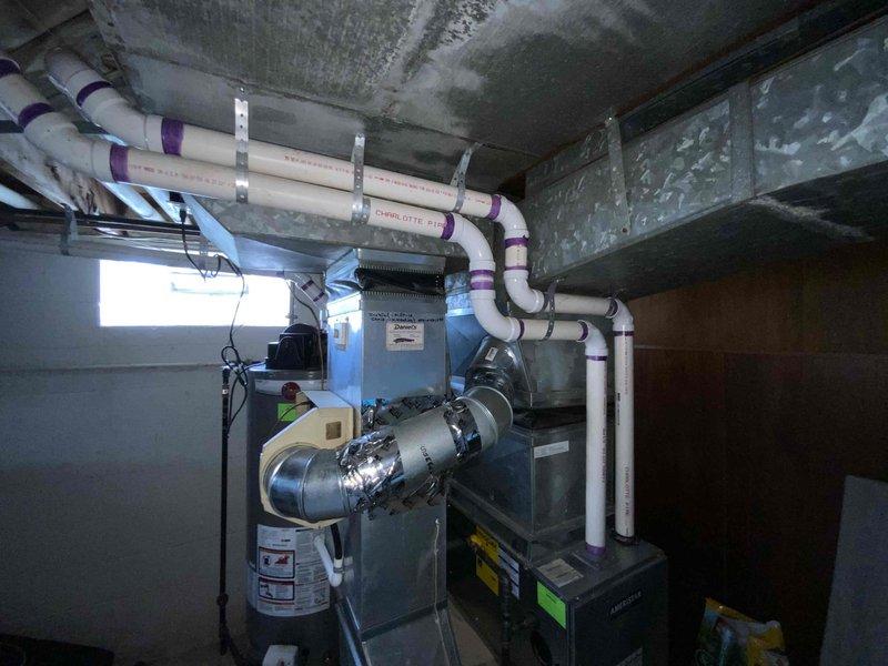 Provided comprehensive estimate for replacement of non-functional 30+ year old air conditioning system located in basement alongside recently installed furnace. Assessed existing HVAC infrastructure including ductwork, PVC condensate drainage lines, and electrical connections to determine optimal replacement specifications for natural gas furnace compatibility and proper system integration.