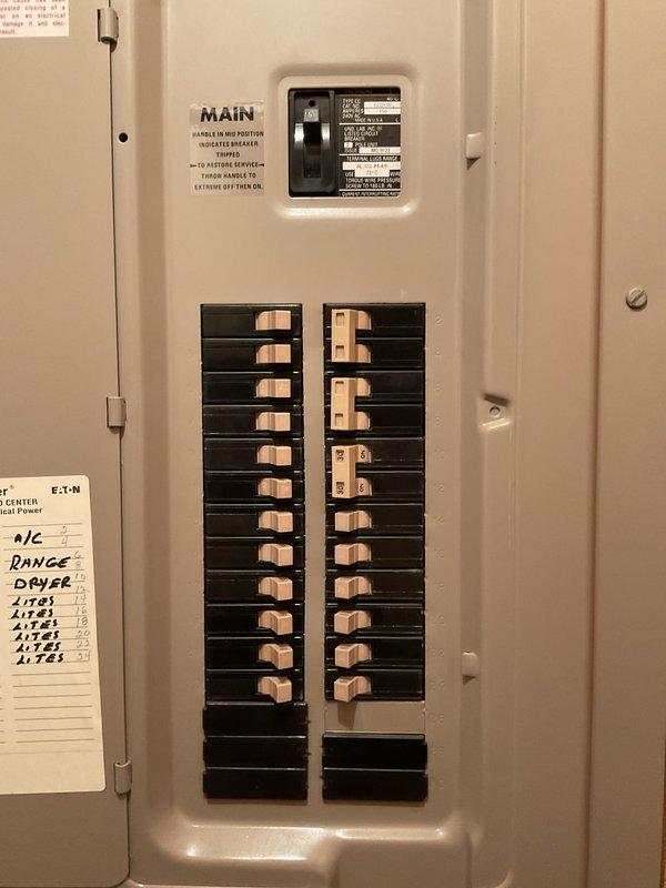 Performed comprehensive whole home electrical inspection in response to reported flickering light issue in basement. Conducted thorough visual examination of main electrical panel, verifying proper circuit breaker operation, labeling accuracy, and overall system integrity. Inspected all accessible circuits, connections, and electrical components throughout the residence. Documented panel configuration showing main breaker and dual columns of branch circuit breakers serving various loads including HVAC, range, dryer, and lighting circuits. All findings photographed for record-keeping purposes.