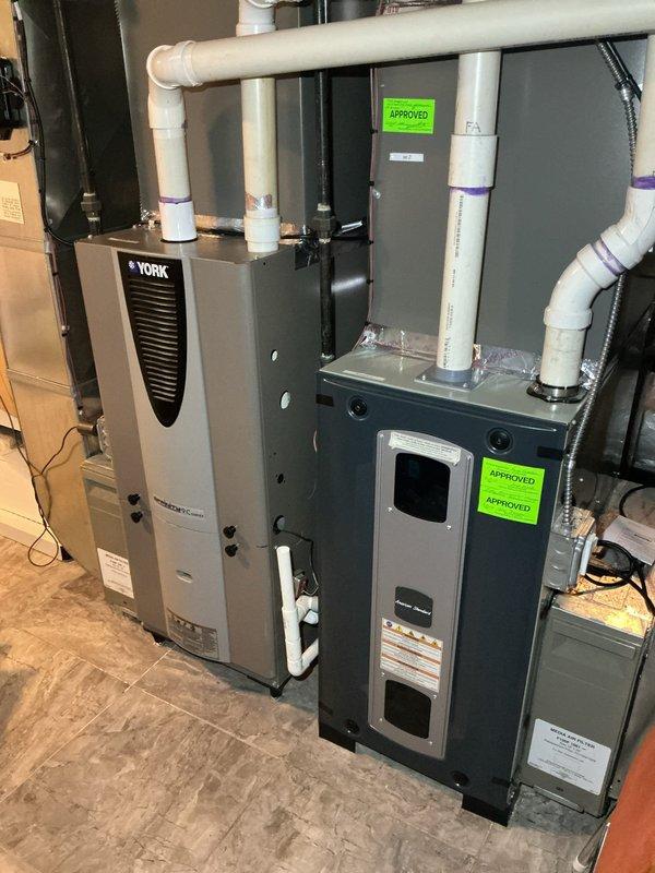 Replaced defective inducer motor assembly on HVAC furnace unit. Removed old inducer motor, installed new replacement unit (part #BLW01401), reconnected all electrical connections and wiring, and verified proper operation of the system.