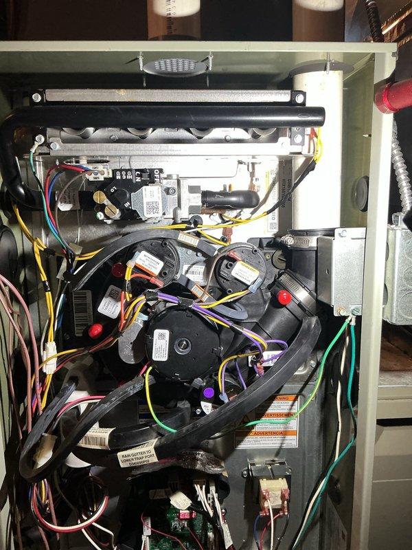 Replaced defective inducer motor assembly on HVAC furnace unit. Removed old inducer motor, installed new replacement unit (part #BLW01401), reconnected all electrical connections and wiring, and verified proper operation of the system.