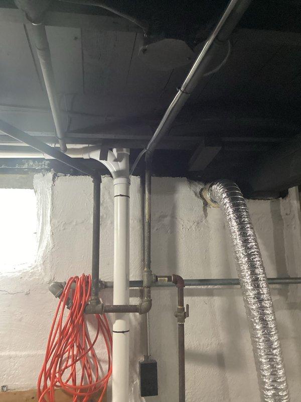 Successfully completed installation of a 2-ton air conditioning system with matching evaporator coil in left-side configuration. Installed new outdoor condensing unit on concrete pad with proper clearances, connected refrigerant lines, and established condensate drainage system utilizing existing PVC piping infrastructure in basement utility area. New dedicated electrical circuit was installed with appropriate conduit and wiring to power the system, and all mechanical and electrical permits were obtained prior to installation.