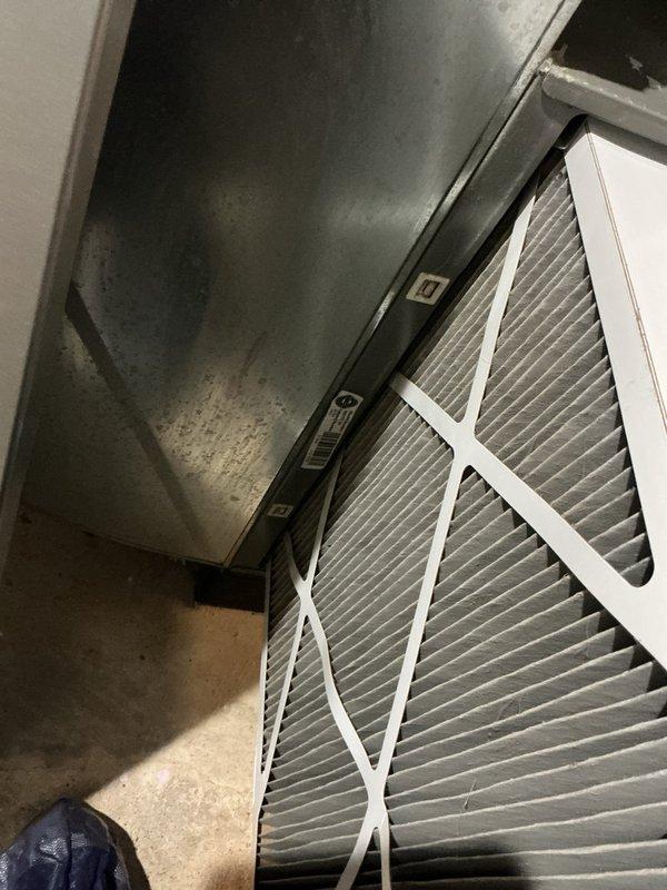 Completed spring maintenance tune-up on residential HVAC system. Performed comprehensive inspection of heating and cooling equipment, verified smart thermostat operation showing proper temperature control at 69°F in cooling mode, and inspected dual air filters in return air plenum which showed clean condition with minimal dust accumulation. System confirmed operational and running efficiently with no deficiencies noted.