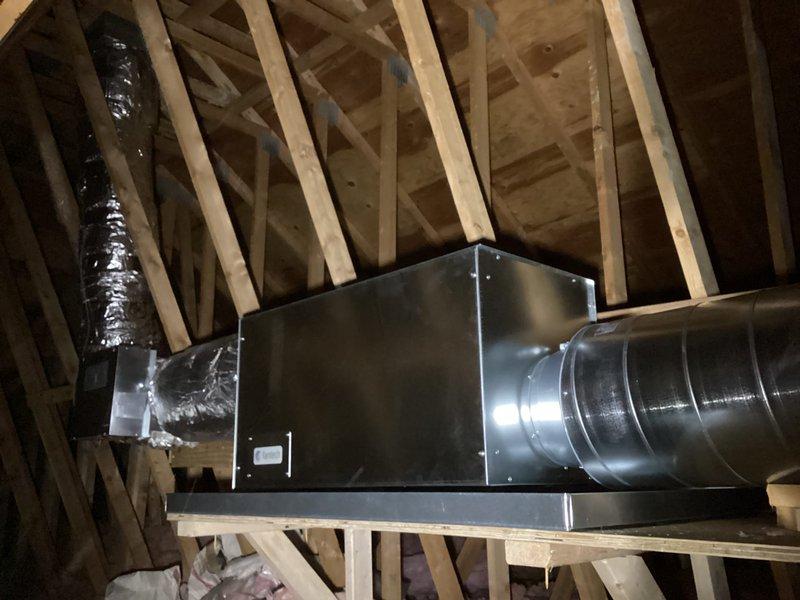 Completed installation of new air handler unit in attic space with associated ductwork modifications. Mounted air handler on wooden platform with proper structural support and connected galvanized metal supply duct and flexible insulated return ductwork. Installed Fantech ventilation system component (Model MURA-10) with HVI certification, integrating unit with existing HVAC infrastructure. All mechanical and electrical permits obtained for air handler installation, duct alterations, EV charger, and 200-amp electrical panel upgrade. System installation coordinated with electrical work scheduled for completion in phases. All equipment properly secured, labeled, and connected per manufacturer specifications and local building codes.