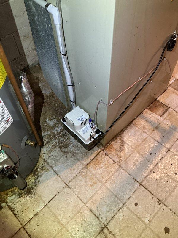 Completed installation of 2-ton air conditioning system with evaporator coil in attic space. Installed Lennox control unit with ductwork connection, properly secured all electrical connections, and reconnected existing electrical service. All components tested and verified operational with system running within manufacturer specifications.