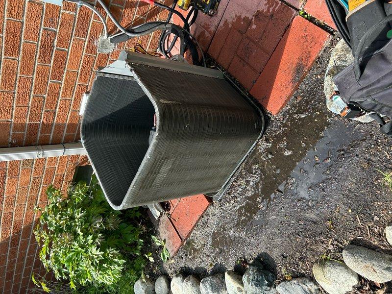 Completed routine air conditioning maintenance visit on residential cooling system. Performed operational diagnostics including temperature measurements at outdoor condensing unit, which registered 67.1°F at time of inspection. Unit found in functional condition with fan assembly operating properly and no immediate service concerns identified.