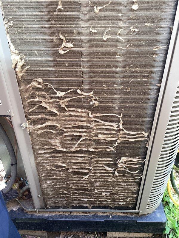 Completed annual cooling maintenance on outdoor HVAC condenser unit. Extensive debris accumulation, dried plant material, and organic matter were found on exterior panels and top grille surfaces. Cleaned unit thoroughly, replaced air filter and evaporative cooler pad as needed. Unit operational upon completion of maintenance service.