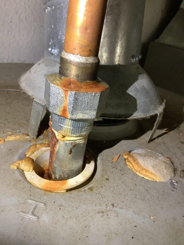 Responded to no hot water complaint on tanked water heater system. Upon inspection, discovered the flue vent pipe had become disconnected from the water heater draft hood assembly. The galvanized vent pipe separation created an unsafe venting condition and prevented proper draft, causing the unit's safety controls to shut down burner operation. Reconnected the flue vent pipe to the draft hood, ensuring proper alignment and secure fit. Verified all venting components were properly seated and sealed. Tested water heater operation after repair, confirmed burner ignition, proper draft through the flue system, and restoration of hot water production. Unit returned to normal operating condition with safe venting restored.