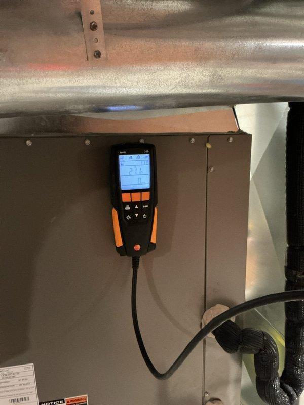 Responded to callback for water leaking from furnace located in basement. Upon inspection, accessed interior mechanical compartment and identified condensate drainage issue on 5+ year old unit. Used diagnostic meter to verify system operation and pinpoint source of water leak. Cleared condensate line obstruction, tested drainage flow, and confirmed proper condensate removal function. Verified blower assembly and internal components were operating correctly with no additional moisture accumulation. System restored to normal operation with no further leaking observed.