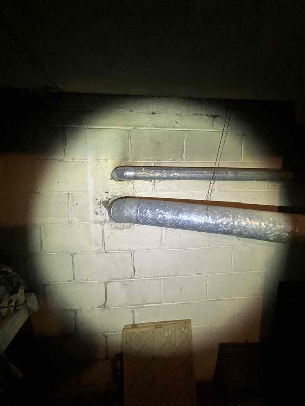 Conducted comprehensive assessment of existing HVAC system in single-family residential property. Evaluated original furnace unit from 1950s/1960s era showing significant age-related deterioration and obsolescence. Inspected basement mechanical area, documented existing ductwork configuration with metal supply ducts showing moisture accumulation and condensation issues. Assessed overall system condition including exposed wiring, aging infrastructure, and spatial constraints for equipment replacement. Provided detailed estimate for complete HVAC system replacement including new furnace installation to replace 65-year-old unit. Customer prepared to proceed with full system replacement pending financing approval.