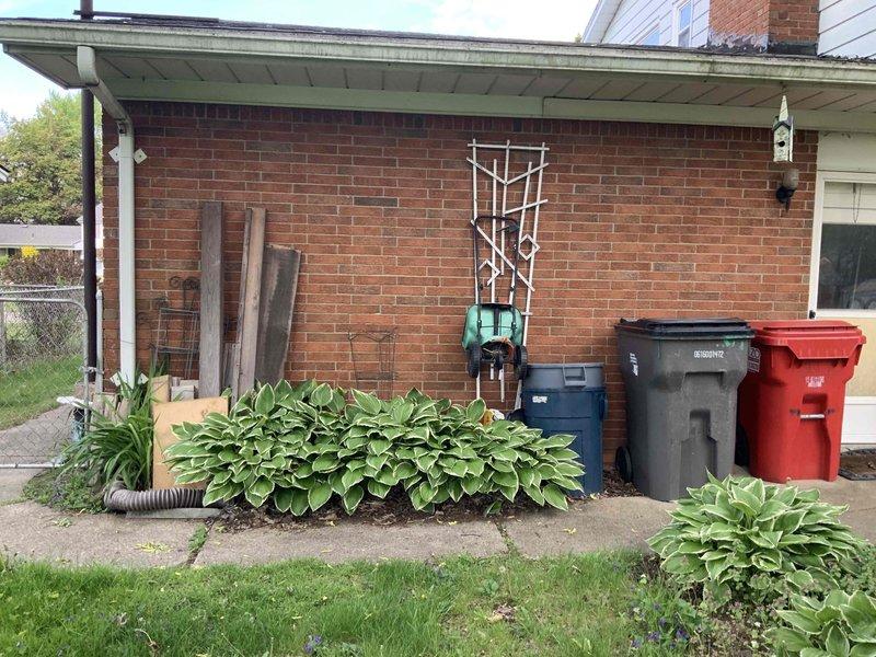 Conducted on-site evaluation for new mini split installation in residential bedrooms to provide air conditioning prior to home sale. Assessed bedroom dimensions (18x12 with 7'5" ceiling height) and existing conditions, including wall-mounted unit location above furnishings. Evaluated exterior placement options for condenser unit along brick wall near covered porch area, considering accessibility for installation and service access.