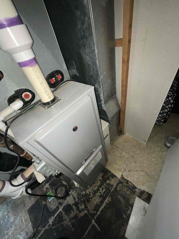 Provided comprehensive estimate for complete HVAC system replacement including heating and cooling components for small to mid-sized residential application up to 1200 square feet. System specified for basement installation with natural gas or propane fuel source, evaluated existing electrical service infrastructure and utility meter configuration for compatibility with new equipment requirements. Assessment included review of current furnace or air handler location, existing ductwork layout, and PVC venting configuration to ensure proper integration of replacement system components.