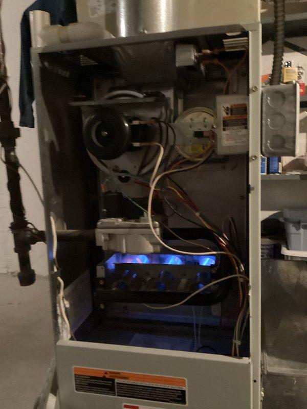 Completed annual heating and cooling maintenance on AHU system. Inspected blower assembly and noted significant dust accumulation on blower wheel fins requiring cleaning attention. Verified furnace operation with burner ignition test showing proper blue flame pattern and confirmed all internal components, wiring connections, and safety controls functioning correctly. Identified filter replacement needed for continued system efficiency.