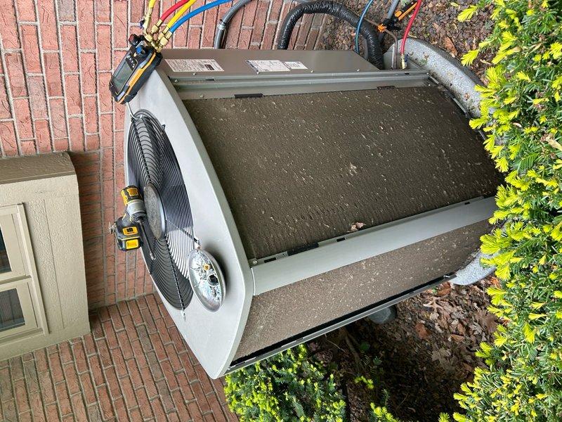 Completed scheduled preventive maintenance on residential air conditioning unit. Performed comprehensive system inspection, replaced air filter and evaporator pad, cleaned condenser coils which showed significant accumulation of dirt and organic debris, verified refrigerant pressures and electrical connections, and confirmed proper operation of all components including condenser fan assembly.