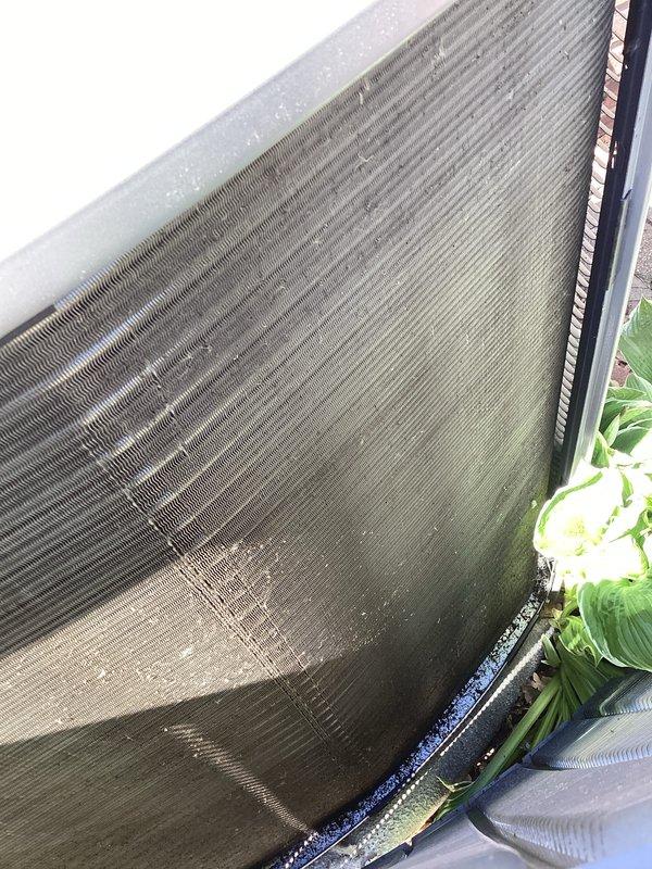 Completed annual cooling maintenance on rooftop zone unit. Inspected condenser coil and found moderate dirt accumulation with concentrated soiling in center and lower sections. Noted significant corrosion damage on portion of coil fins with visible oxidation and surface deterioration requiring monitoring. Documented equipment condition with photos showing debris buildup at base and environmental exposure affecting unit performance. Recommended future coil cleaning to restore heat transfer efficiency.