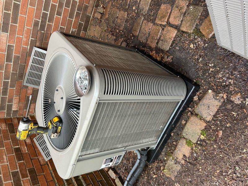 Completed comprehensive 5-year ComfortGuard maintenance visit on split HVAC system including outdoor condenser unit and indoor air handler. Performed thorough inspection of exterior condenser unit positioned on composite pad, checking refrigerant levels, electrical connections, and fan motor operation. Inspected indoor air handler cabinet in mechanical room, verifying blower motor assembly, capacitors, and internal electrical components. Examined PVC condensate drainage system with proper connections and copper refrigerant line sets for integrity. Cleaned and serviced both units according to manufacturer specifications to ensure optimal system performance and efficiency.