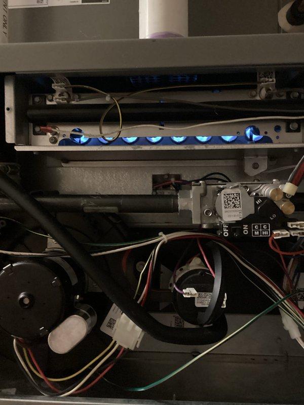 Completed complimentary annual heating maintenance on furnace system. Performed comprehensive tune-up including inspection of blower motor assembly with verification of electrical connections and wiring integrity. Observed burner operation with proper blue flame combustion pattern across all burners, confirming optimal fuel-air mixture and safe system operation. All components functioning within normal parameters.