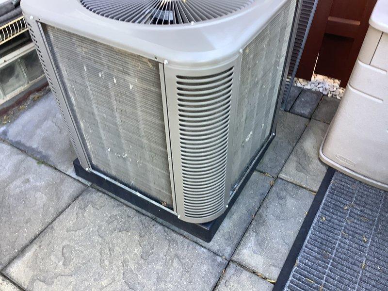 Performed annual cooling maintenance on residential outdoor condensing unit. Completed comprehensive system inspection, cleaned condenser coils and exterior surfaces showing weathering and discoloration, verified refrigerant lines and connections, tested fan motor operation, and confirmed unit operational status with all components functioning within normal parameters.