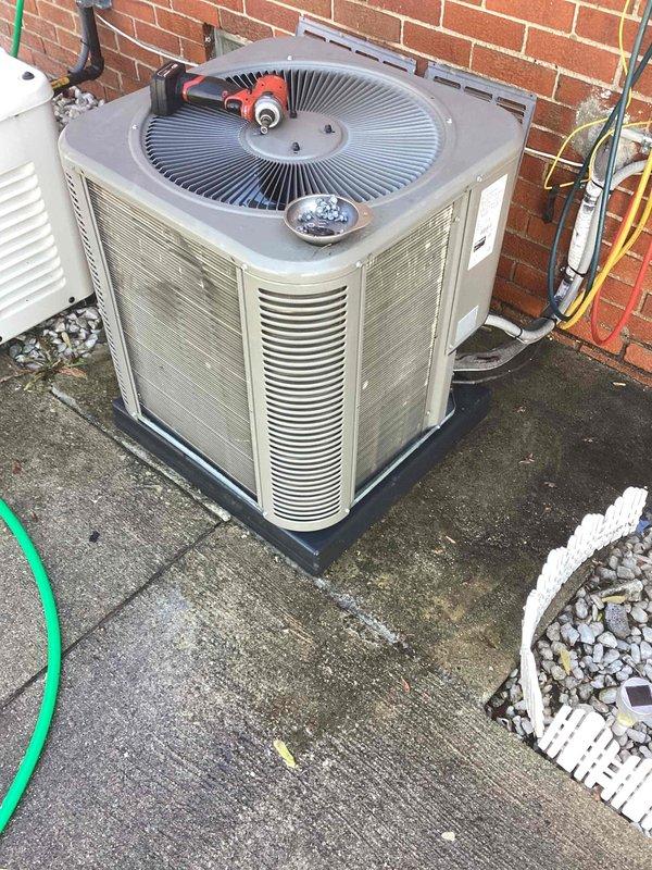 Completed scheduled maintenance on residential outdoor air conditioning condenser unit. Performed standard ACM procedures including inspection of fan assembly, motor components, electrical connections, and louvered ventilation panels. Unit found in functional condition with normal operational wear; all components operating within acceptable parameters at time of service.