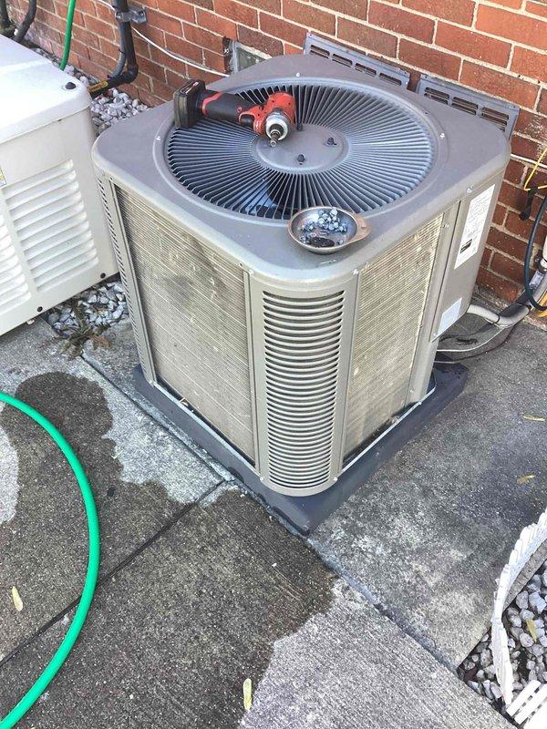 Completed scheduled maintenance on residential outdoor air conditioning condenser unit. Performed standard ACM procedures including inspection of fan assembly, motor components, electrical connections, and louvered ventilation panels. Unit found in functional condition with normal operational wear; all components operating within acceptable parameters at time of service.