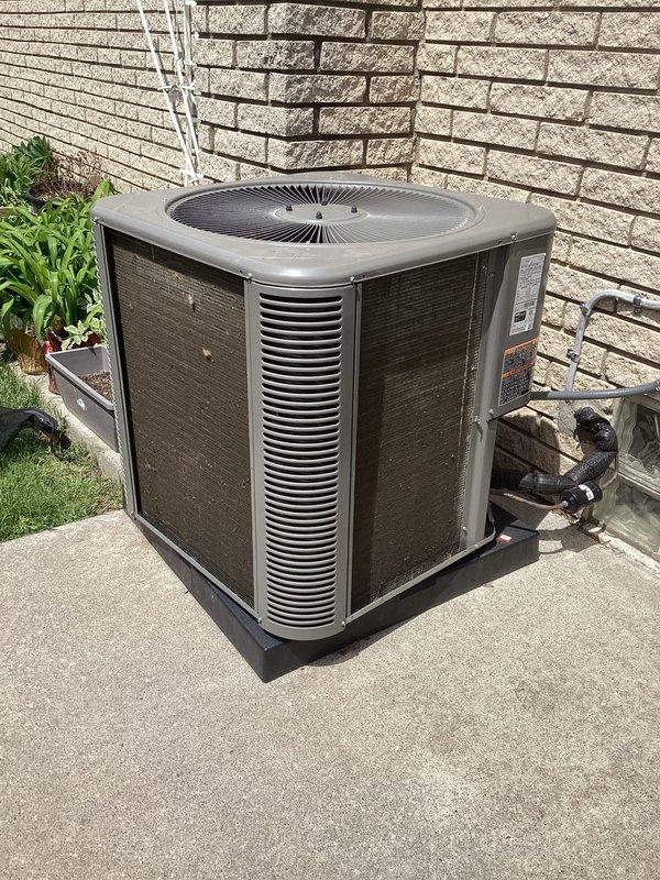 Completed scheduled Air Care Maintenance on residential air conditioning system. Performed comprehensive inspection of outdoor condenser unit, verified proper operation of compressor and condenser fan motor, checked refrigerant line connections for leaks, cleaned condenser coils and louvers to remove accumulated dirt and debris, and confirmed electrical disconnect box functionality. Unit operating within normal parameters with no deficiencies noted.