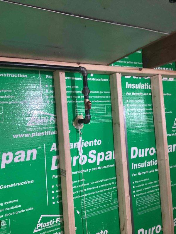 Installed new gas piping system in accordance with mechanical permit requirements. Routed copper gas line through wall cavity between framing members, securing pipe properly to structural supports. Completed installation with all connections tested and ready for inspection.