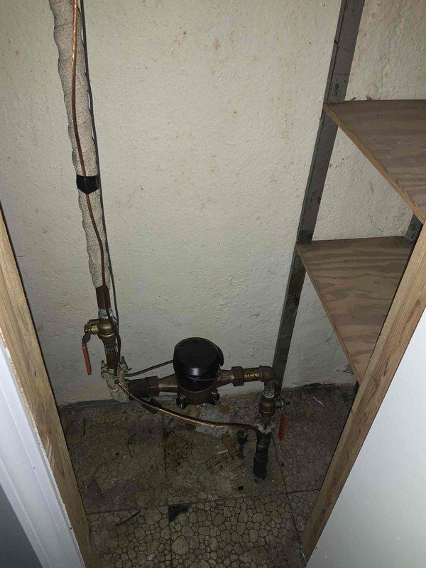 Provided comprehensive estimate for complete HVAC system replacement including furnace, air conditioning unit, and hot water heater, all located in basement mechanical space. Existing equipment is over 17 years old but currently operational, with visible aging infrastructure including deteriorated flooring, older ductwork with galvanized finish, and existing refrigerant lines requiring replacement to accommodate modern efficiency standards.