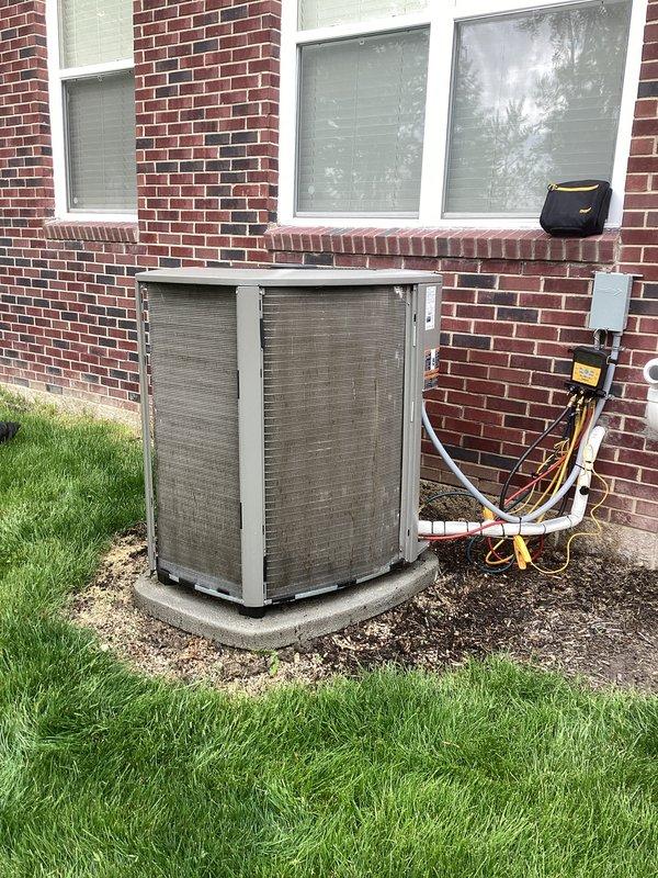 Completed annual cooling maintenance on residential split system air conditioning unit. Performed comprehensive inspection of outdoor condenser unit, which showed significant accumulation of dirt and debris on exterior panels and condensation coils. Verified refrigerant line connections and electrical components were secure and functioning properly. Inspected concrete equipment pad for stability and proper drainage. Unit operational at time of service completion.