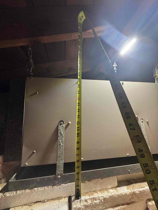 Conducted site assessment for air conditioner replacement on forty-year-old system. Performed attic inspection to evaluate existing ductwork configuration and clearance measurements for new equipment installation. Documented current HVAC system layout including horizontal plenum positioning, mounting hardware, flexible ductwork routing, and available workspace above insulated ceiling plane to determine installation requirements and equipment specifications for upcoming replacement quote.
