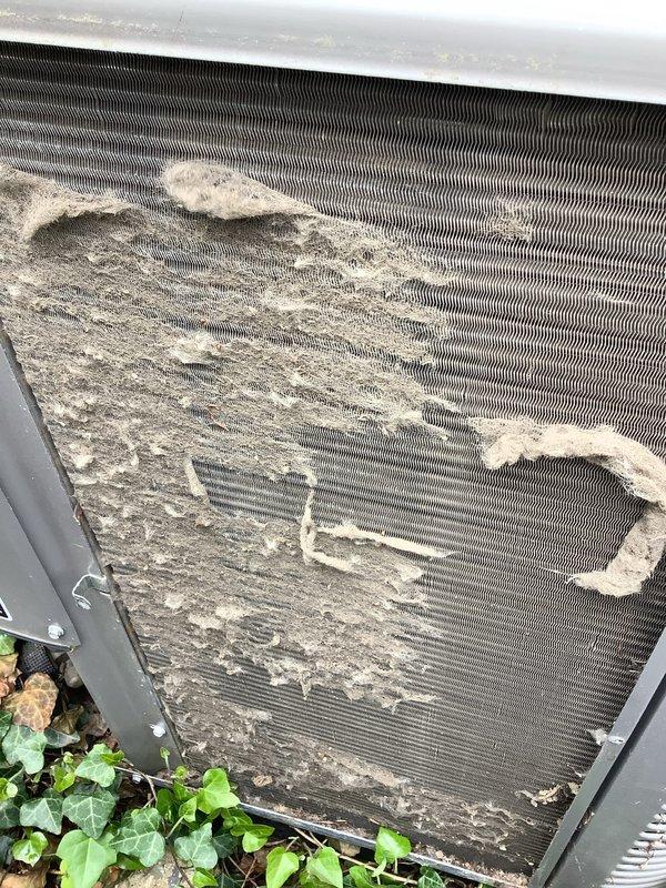 Completed annual cooling maintenance on residential air conditioning system. Condenser coils exhibited heavy accumulation of dust, lint, and outdoor debris significantly restricting airflow through fins. Cleaned and serviced condenser unit, removing debris buildup to restore proper heat exchange efficiency. Verified system operation with supply air temperature reading of 48°F at register, confirming adequate cooling performance post-maintenance.