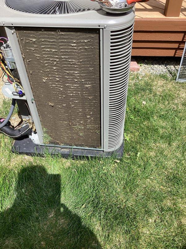 Completed routine Air Care Maintenance on residential cooling system. Replaced dirty air filter with new HCF16-11 (MERV 11) filter as customer was entitled to complimentary replacement. Inspected outdoor condenser unit and noted heavy accumulation of dirt, dust, and debris on condenser coils requiring attention. Documented equipment condition with photos showing clogged coil fins and overall system wear, which may impact cooling efficiency if not addressed during future maintenance.