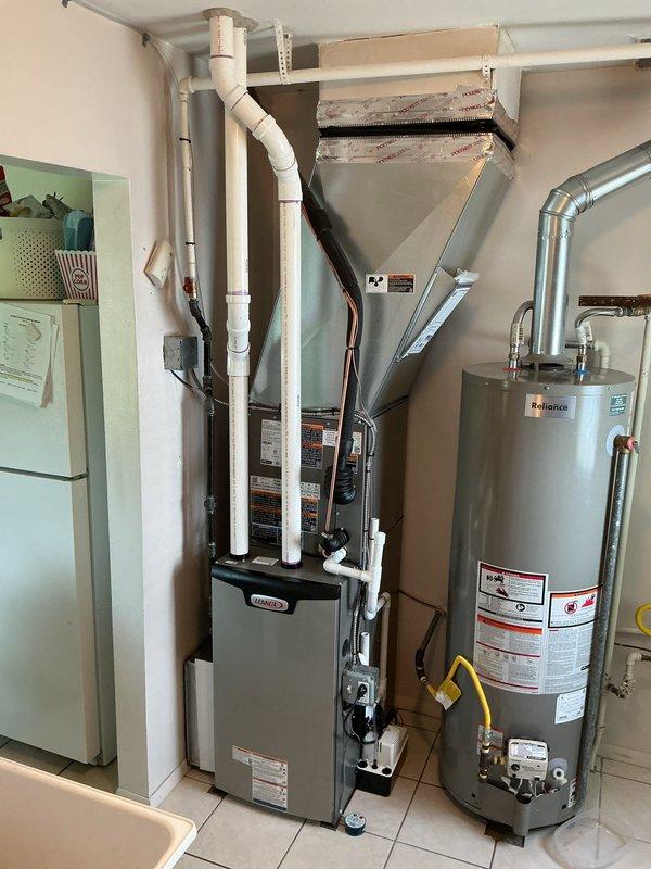 Completed full HVAC system installation including a 70,000 BTU furnace and 2-ton air conditioning unit with rear yard condenser placement. Installation included all necessary venting with PVC piping, ductwork integration, electrical connections at dual meter setup, and system reconnection. All mechanical and electrical permits were obtained prior to installation, and the complete system was tested and verified operational in the utility room location.