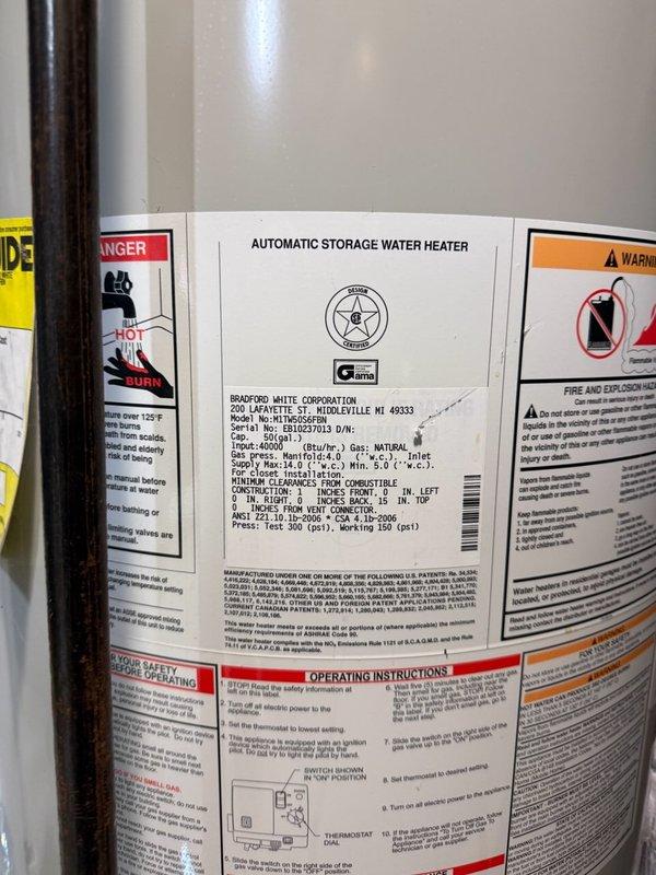 Completed routine ACM maintenance service including filter inspection and replacement. Documented water heater installation and plumbing configuration with copper piping, brass fittings, and circulation system components all operating within normal parameters.